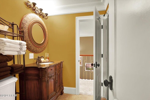 bathroom featuring crown molding, vanity, and tile patterned floors