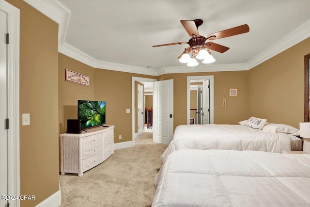 carpeted bedroom with ceiling fan and crown molding