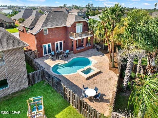 view of swimming pool featuring a lawn and a patio area