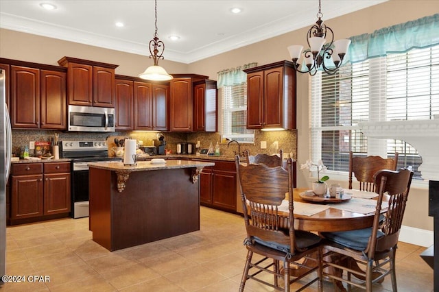 kitchen featuring backsplash, decorative light fixtures, an inviting chandelier, light tile patterned floors, and range with electric stovetop