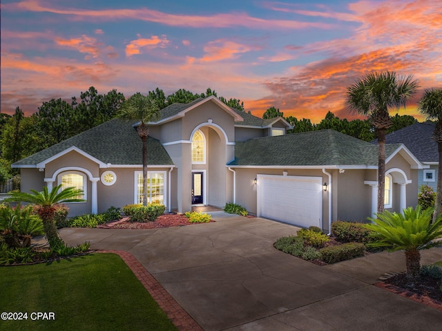 view of front of property with a garage