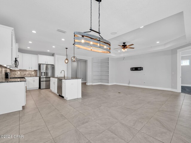 carpeted bedroom featuring ceiling fan and multiple windows