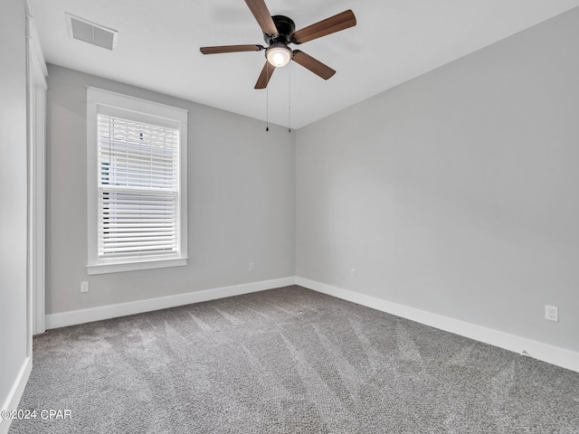 carpeted empty room with ceiling fan