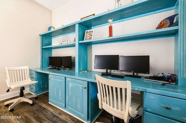 office space featuring dark wood-type flooring and built in desk