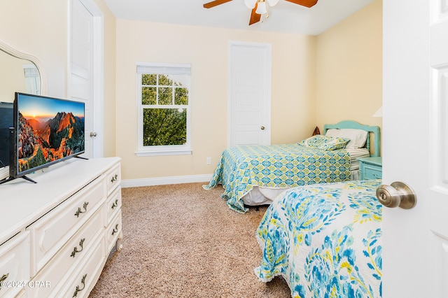 bedroom featuring light carpet and ceiling fan