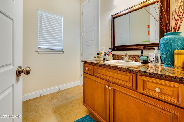 bathroom with tile patterned floors and vanity