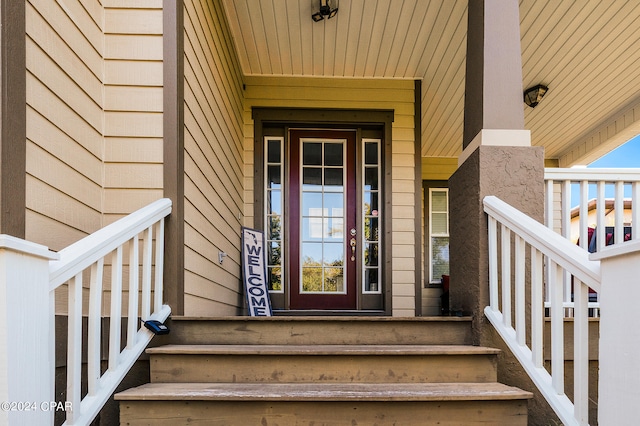 doorway to property featuring covered porch