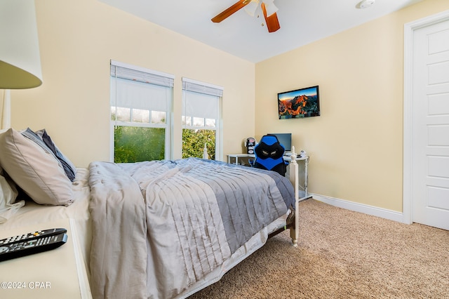 bedroom with ceiling fan and carpet flooring