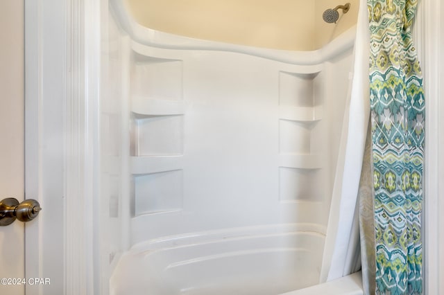 bathroom featuring shower / bath combination with curtain