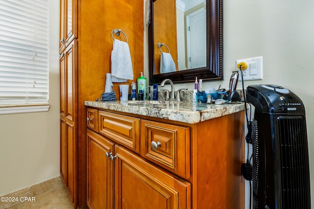 bathroom with tile patterned flooring and vanity