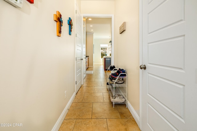 corridor featuring light tile patterned floors