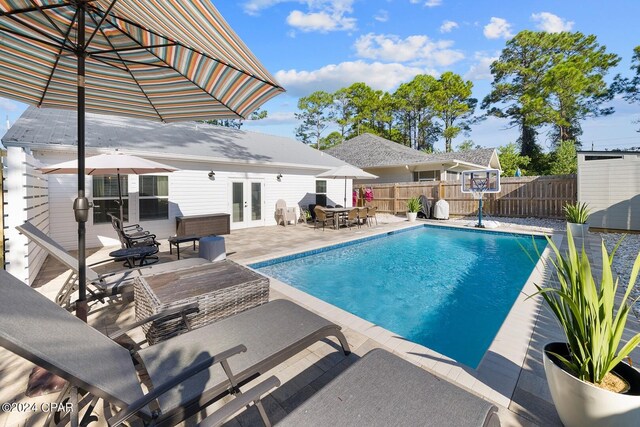 view of swimming pool featuring a patio area