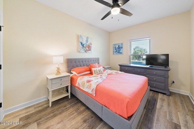 bedroom featuring ceiling fan and wood-type flooring