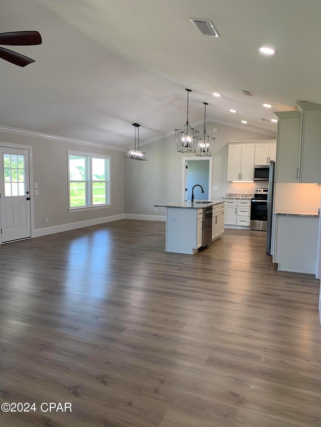 kitchen featuring decorative light fixtures, appliances with stainless steel finishes, dark wood-type flooring, sink, and white cabinetry