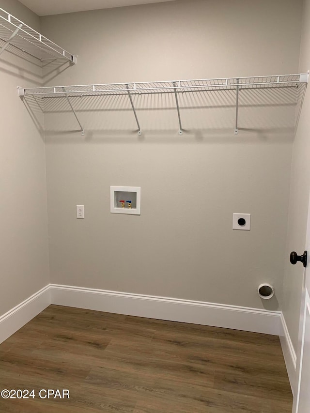 laundry area featuring hookup for a washing machine, wood-type flooring, and electric dryer hookup