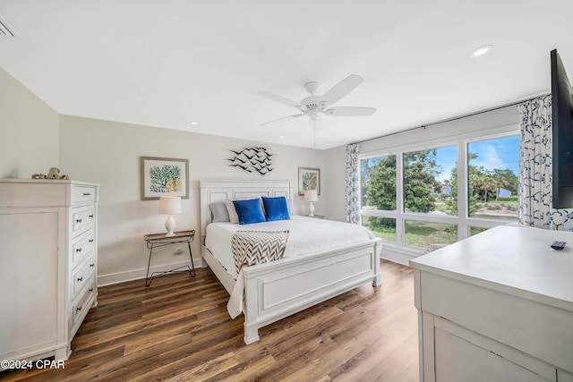 bedroom featuring dark hardwood / wood-style floors and ceiling fan