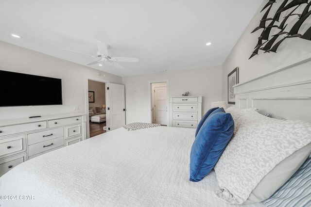 bedroom with dark hardwood / wood-style flooring