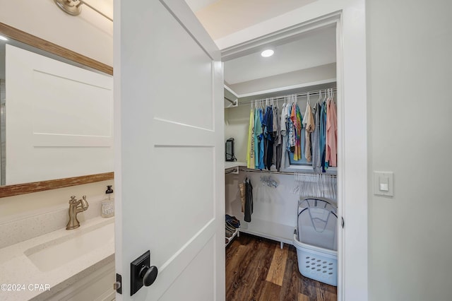 interior space with vanity and hardwood / wood-style flooring