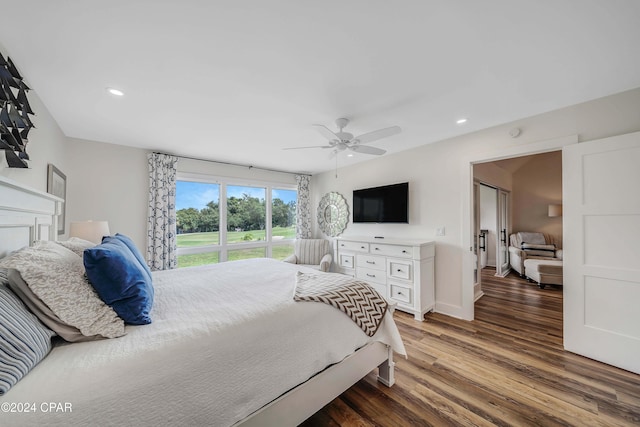 bedroom with dark wood-type flooring and ceiling fan