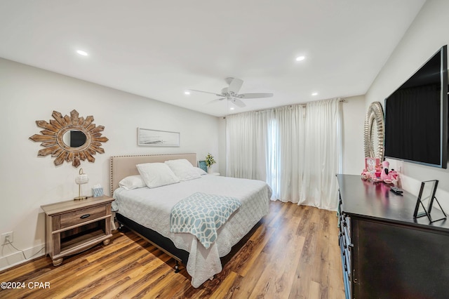 bedroom featuring hardwood / wood-style flooring and ceiling fan