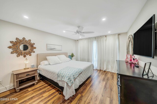 bedroom featuring wood-type flooring and ceiling fan