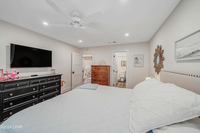 bedroom with ceiling fan and ensuite bath