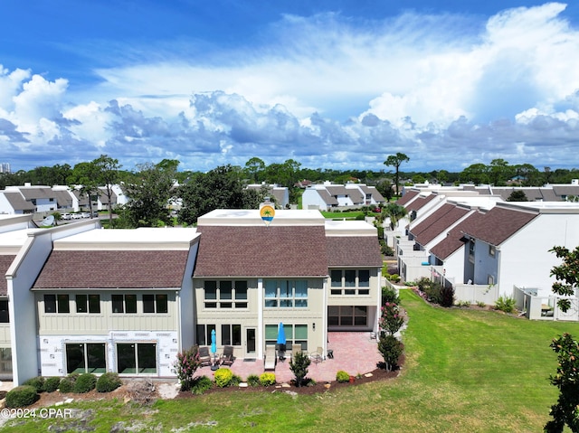 back of house featuring a lawn and central AC unit