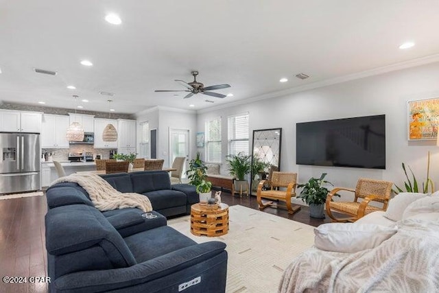 living room with wood finished floors, visible vents, recessed lighting, ceiling fan, and crown molding