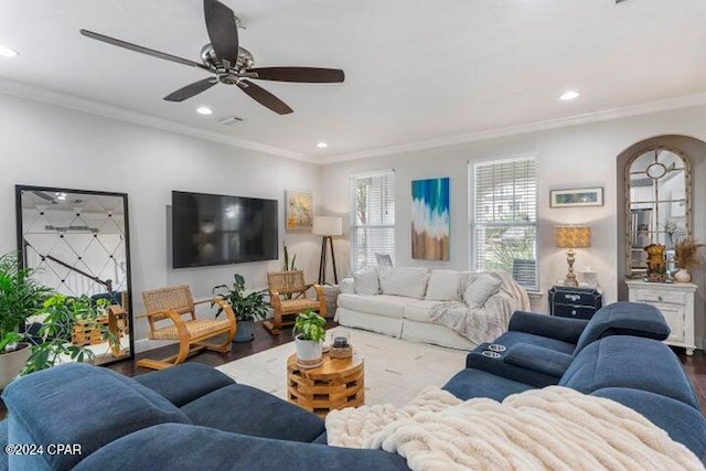 living room featuring ceiling fan, wood-type flooring, and ornamental molding