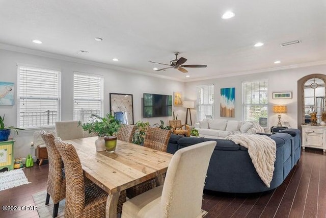 living room featuring dark hardwood / wood-style flooring, ornamental molding, and ceiling fan