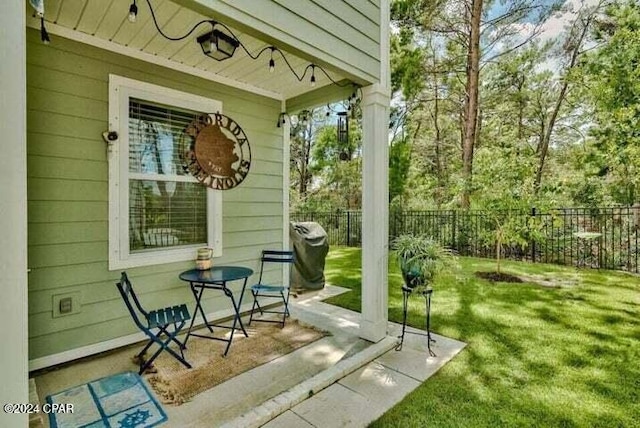 view of patio featuring fence