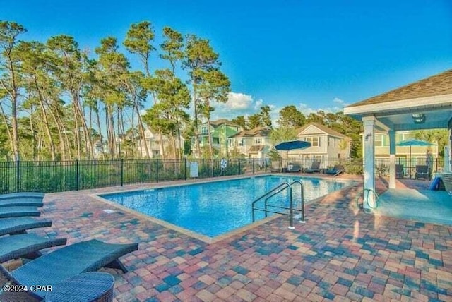 view of swimming pool featuring a patio