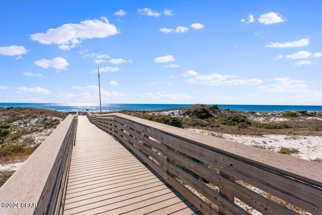 view of home's community featuring a view of the beach and a water view