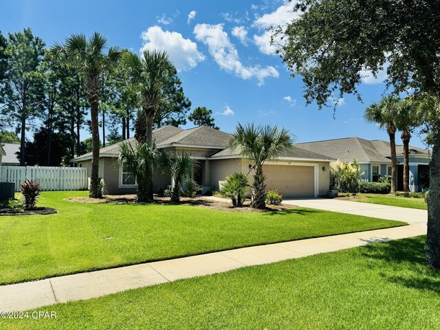 single story home with a front lawn and a garage