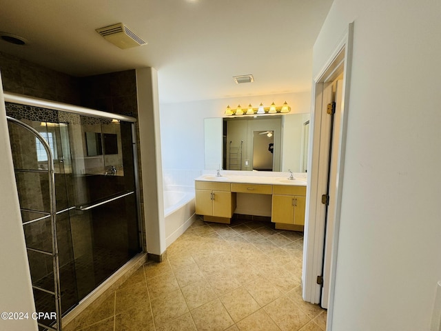 full bath featuring double vanity, a garden tub, a shower stall, and visible vents