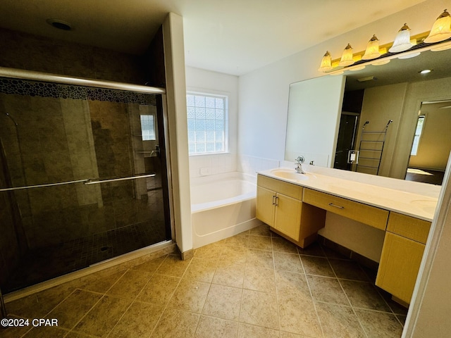 full bath with double vanity, a stall shower, a sink, and a bath