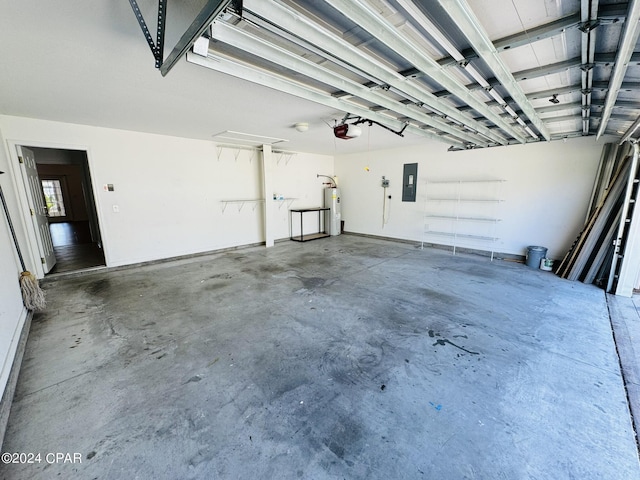 garage with water heater, electric panel, and a garage door opener