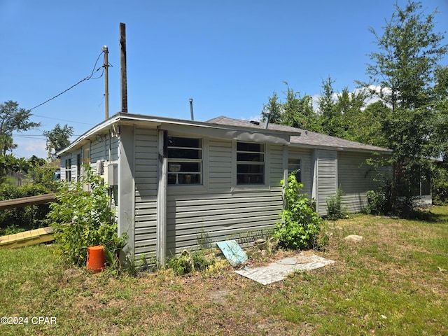 view of outbuilding featuring a yard