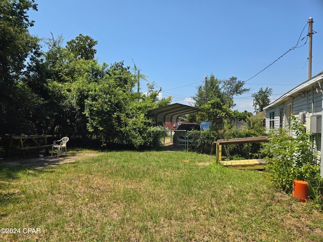 view of yard featuring a carport