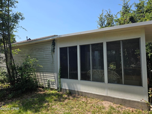 view of home's exterior featuring a sunroom