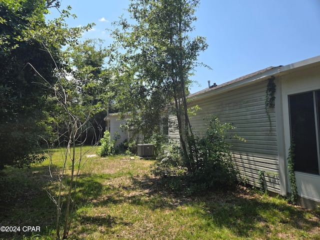 view of yard featuring central AC