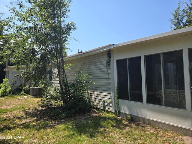 view of side of home with a sunroom