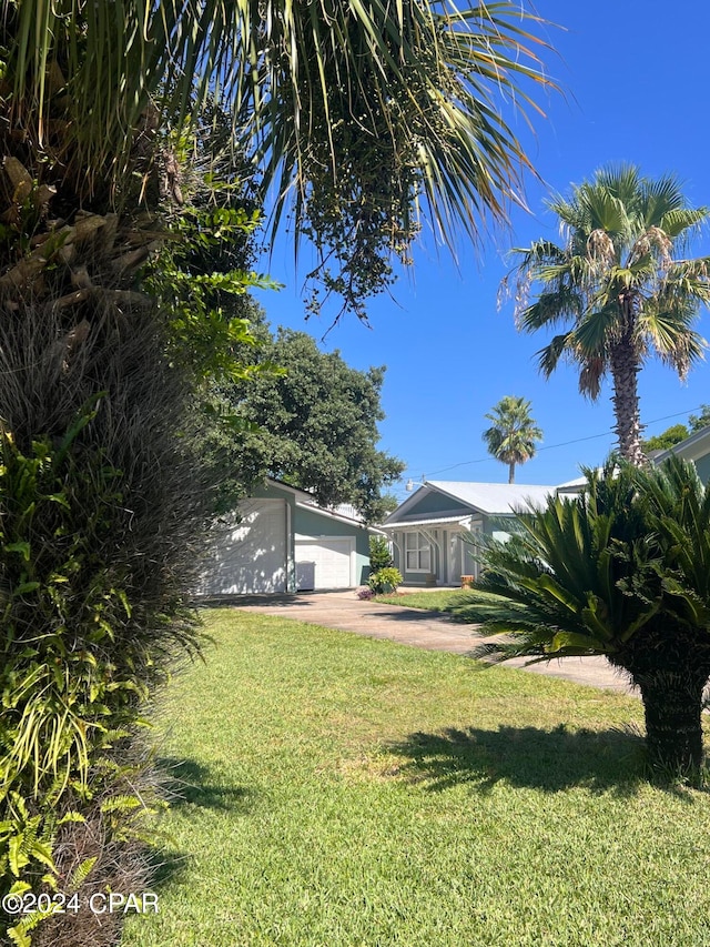 view of yard with a garage