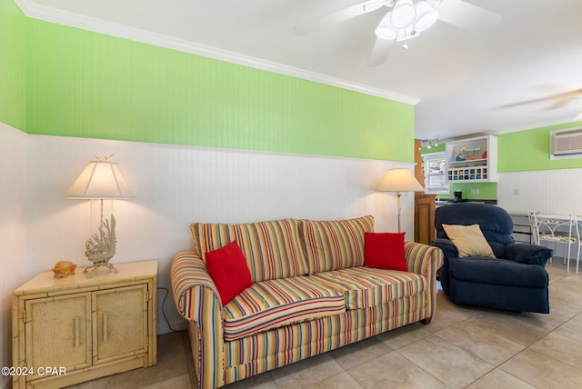 living room with ceiling fan, crown molding, light tile patterned floors, and a wall unit AC