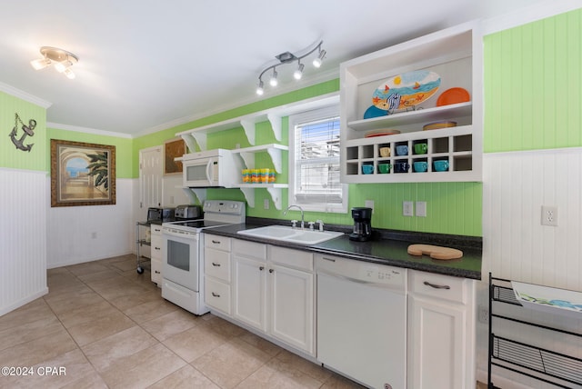 kitchen with sink, ornamental molding, white appliances, light tile patterned floors, and white cabinets