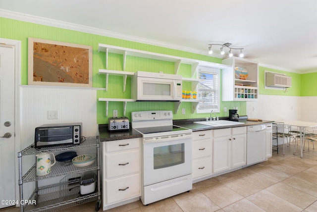 kitchen featuring sink, ornamental molding, white appliances, white cabinetry, and a wall unit AC