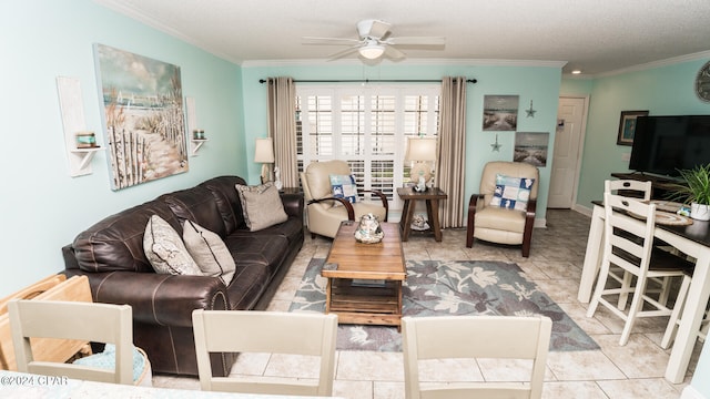 tiled living room with ceiling fan, a textured ceiling, and ornamental molding