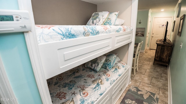 bedroom featuring crown molding