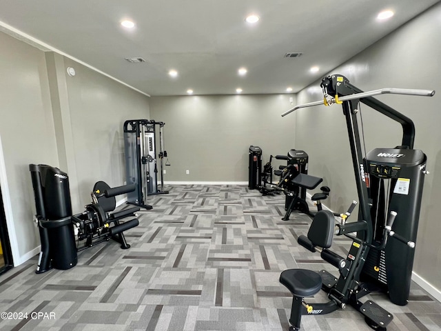 workout room featuring light colored carpet