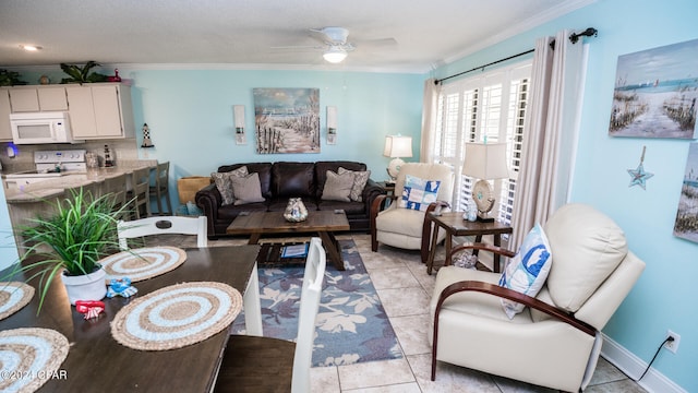 living room with ceiling fan, light tile patterned floors, and ornamental molding